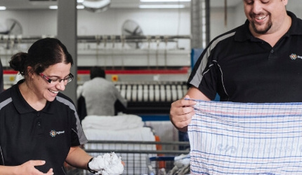 Brightwater Linen Staff Folding Linen Our Clients Thumbnail