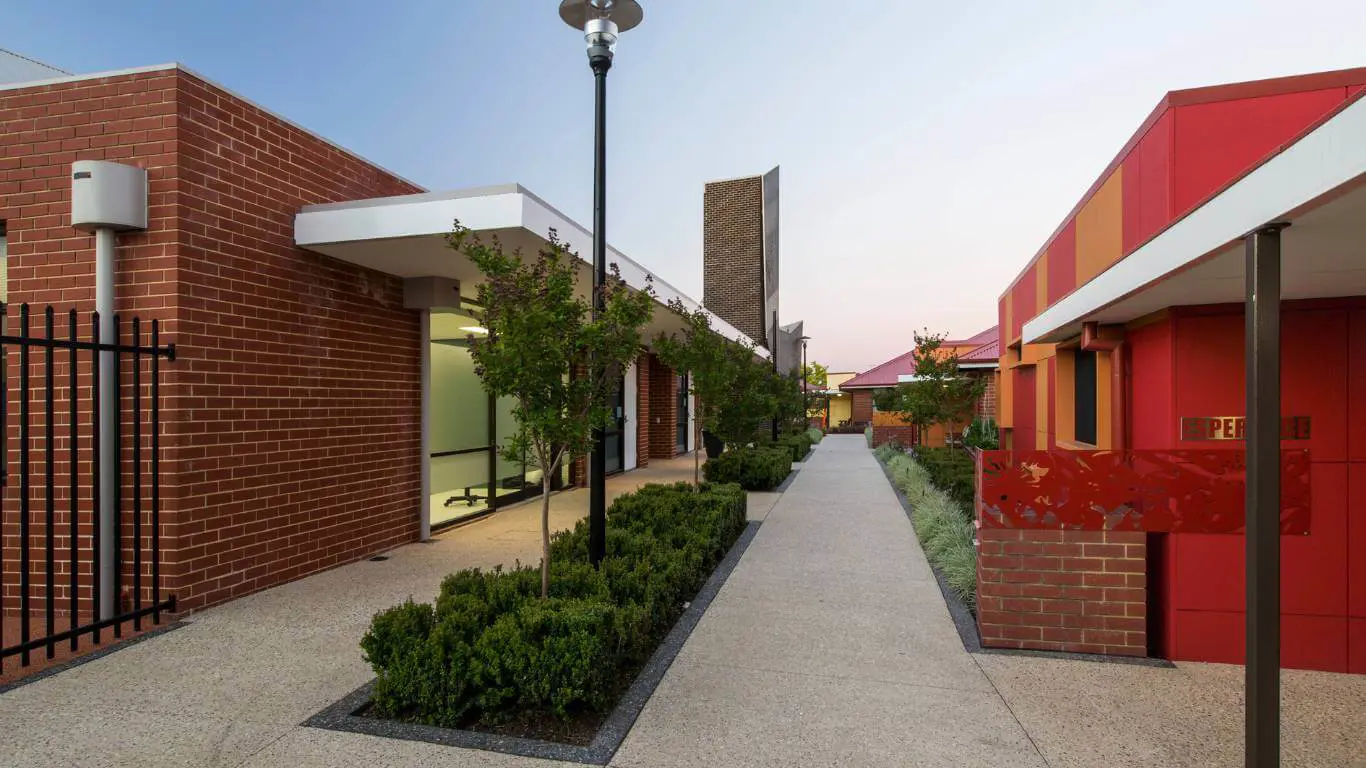 Brightwater Oats Street_wide view of red, orange brick buildings with garden plants and Esperance unit in Vic Park Perth WA