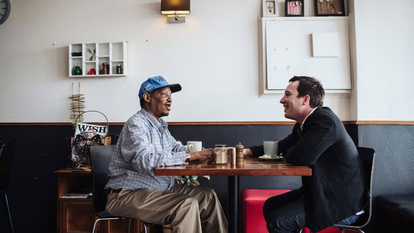 Brightwater Psychology Services_disability client at coffee shop catching up with their mentor