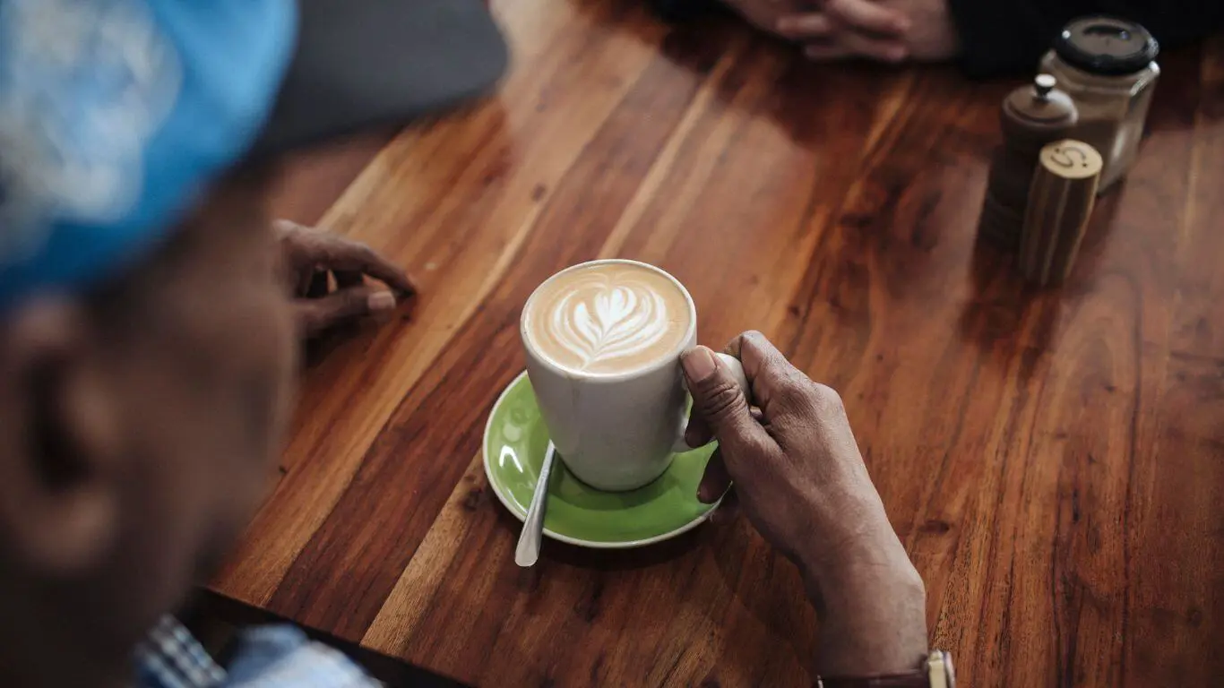 Brightwater Psychology Services_disability client enjoying hot coffee at coffee shop