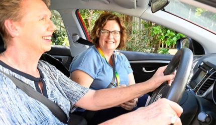 Brightwater Disability Occupational Therapy Driving Assessment_instructor smiling at client in driving assessment practical