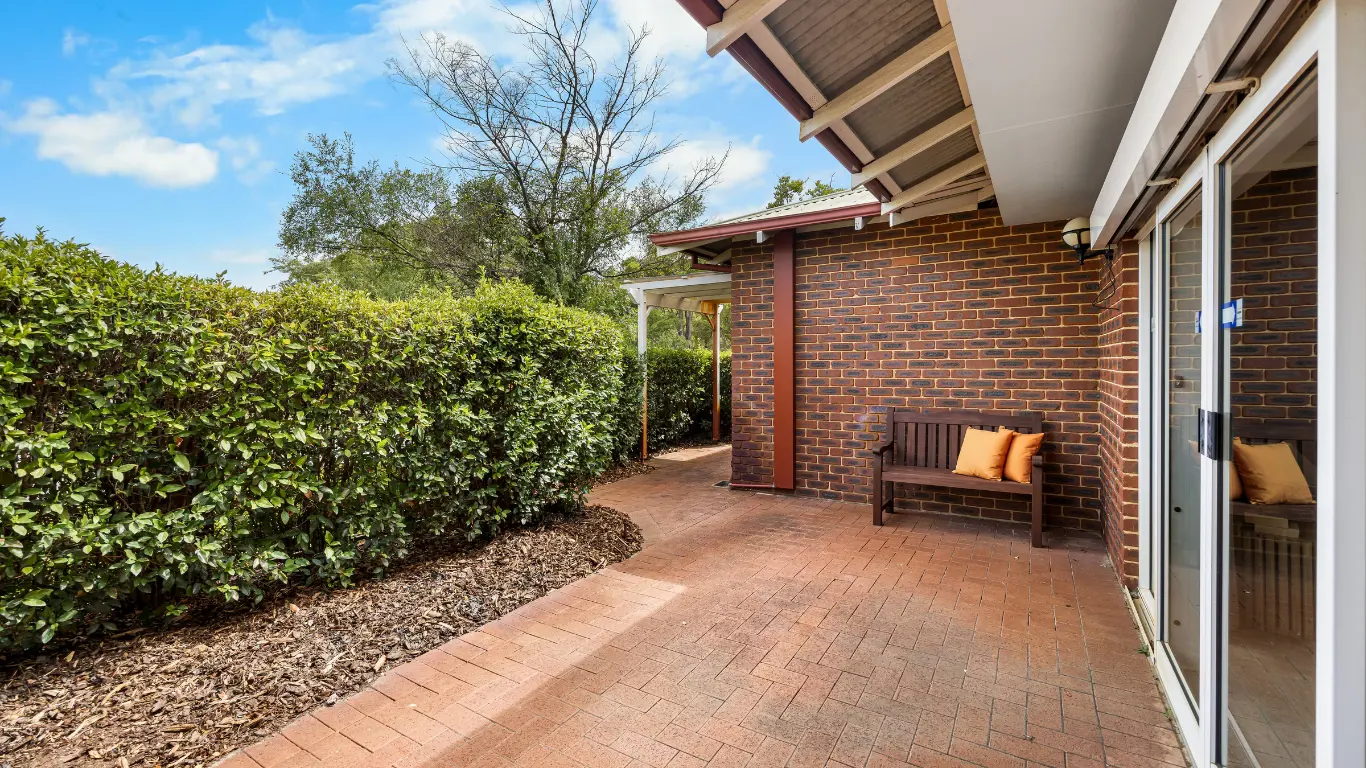 Aylesford Supported Independent Living Home Marangaroo_sliding door out to paved outdoor area with lush hedges