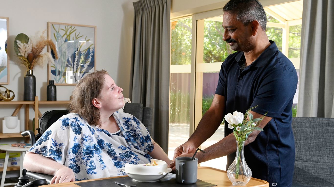 Brightwater Neurological Conditions_disability client being served their meal from staff