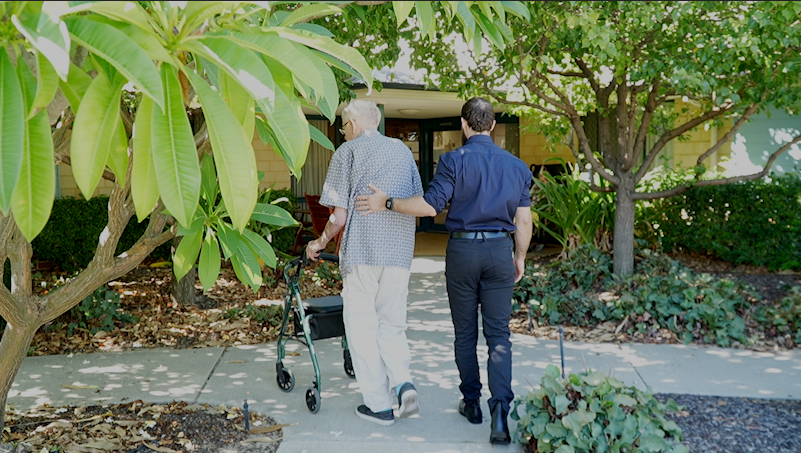 Brightwater Parkinson's Disease_What is Parkinson's Youtube video thumbnail with elderly man in outdoor bush area