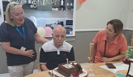 Brightwater Supported Independent Living Client Edmond celebrates his birthday at Kingsley Young Onset Dementia SIL with family and staff