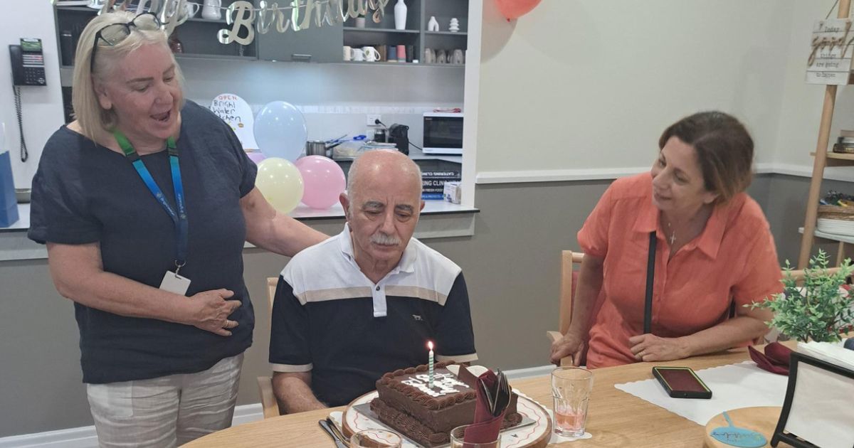 Brightwater Supported Independent Living Client Edmond celebrates his birthday at Kingsley Young Onset Dementia SIL with family and staff