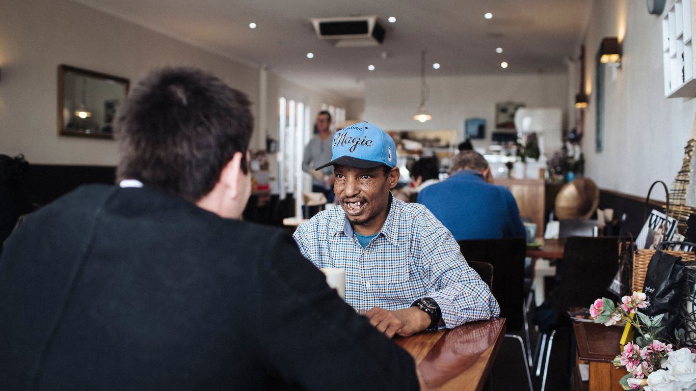 Brightwater Positive Behaviour Support Services_disability client catching up with mate at coffee shop